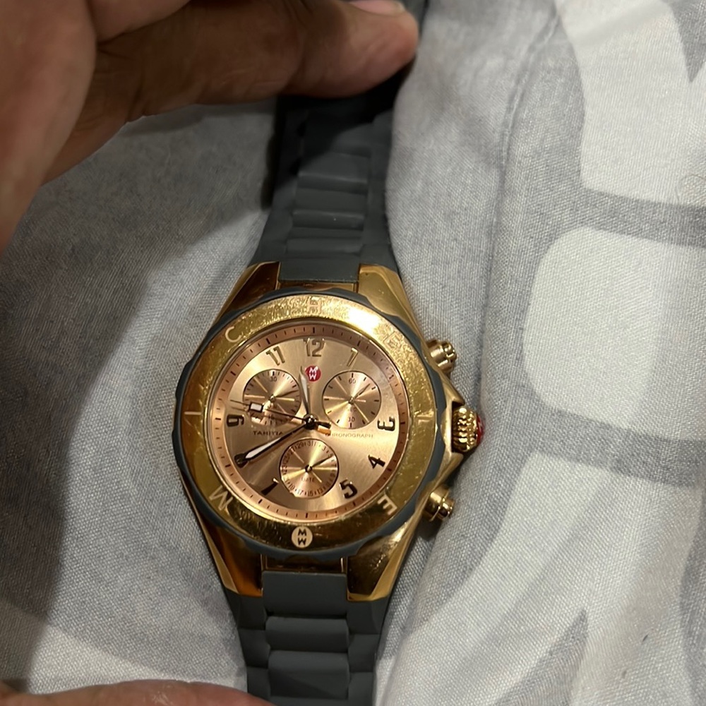 Women’s Michele watch. Rubber band(grey) , rose gold face. Needs a battery